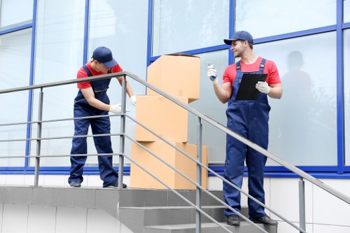 Professional removals team loading furniture for a same day move