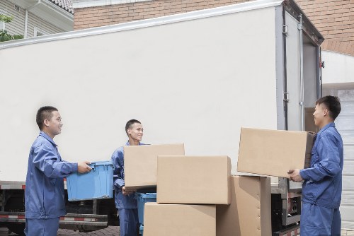 Local moving team navigating a Fulham street with a removal van