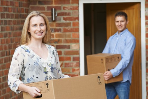 Removal team preparing boxes and furniture for a move in Fulham