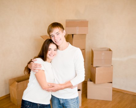 Unpacking boxes in a Fulham apartment after moving day