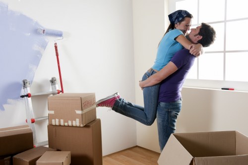 Specialist movers loading a piano for transport