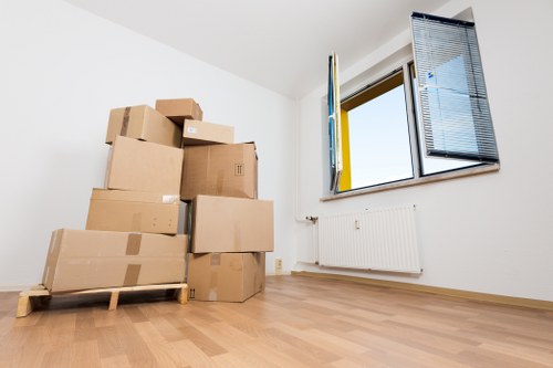 Packed office equipment prepared for relocation in Fulham