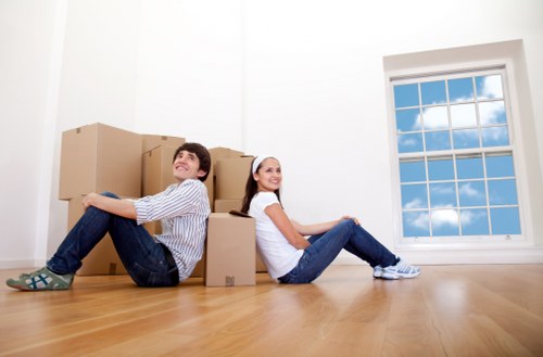Unpacking and organising boxes in a Fulham flat after moving day
