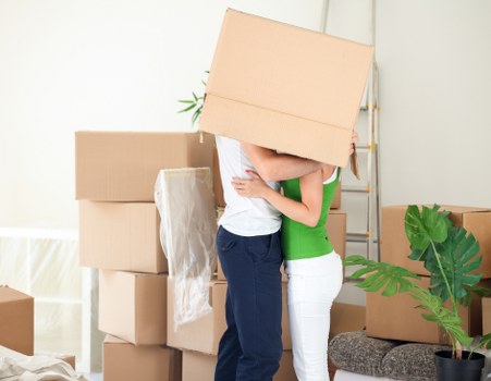 Trained Fulham moving staff handling furniture carefully during loading