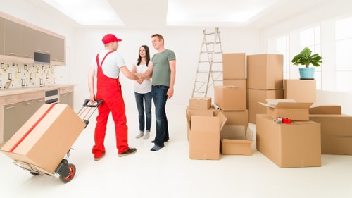 Furniture being carried into a new Fulham property