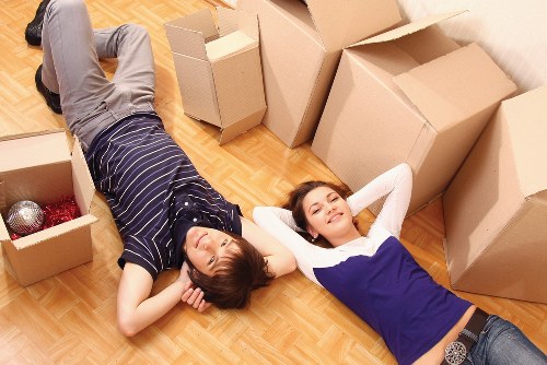 Moving team unloading boxes during student removals in Fulham