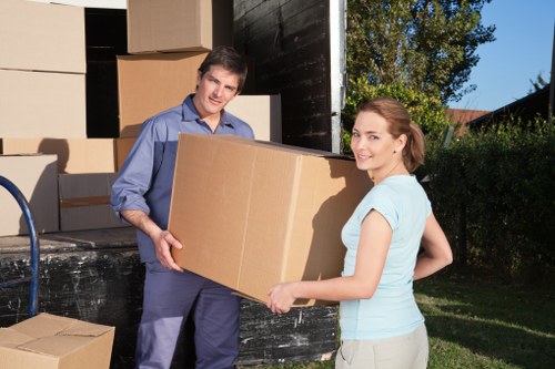 Furniture and boxes prepared for transport by a Fulham removal van